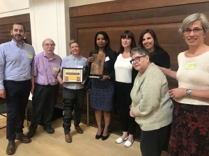 The Dyke Road Staff Team receive the trophy and certificate from the judges